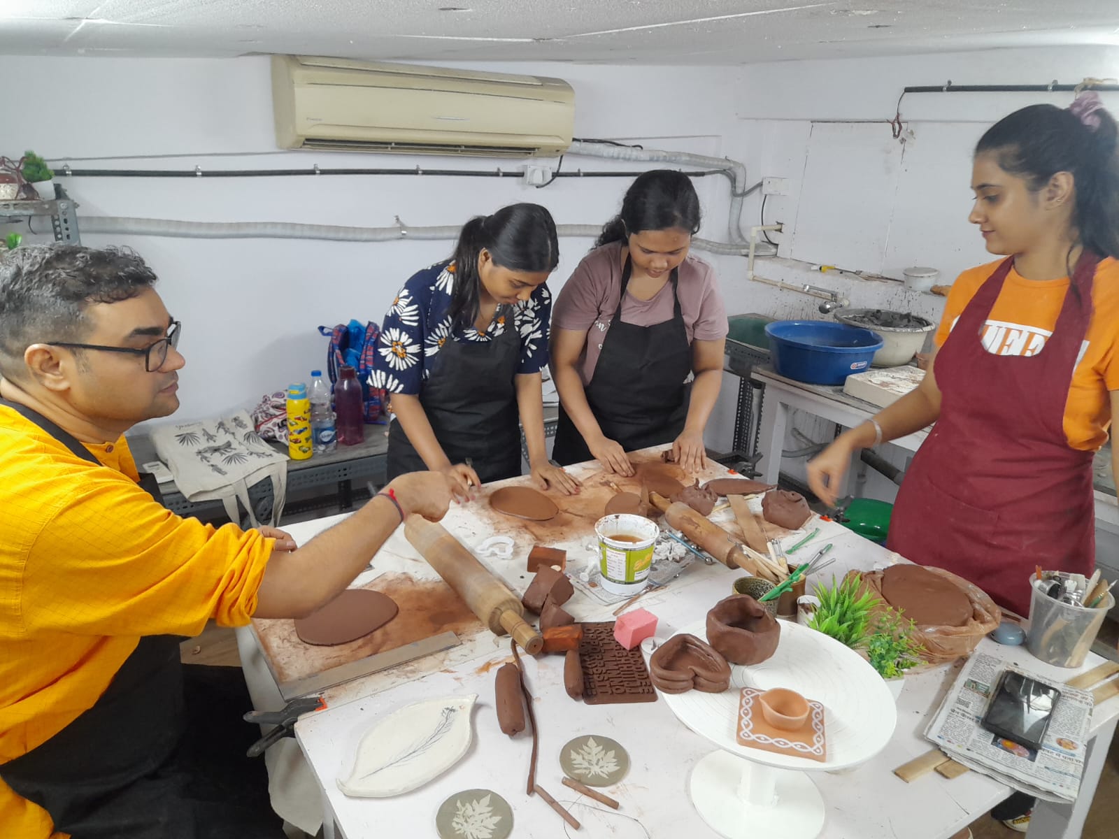 Participants learning pottery and clay art in a hands-on training workshop conducted by Giridham Foundation