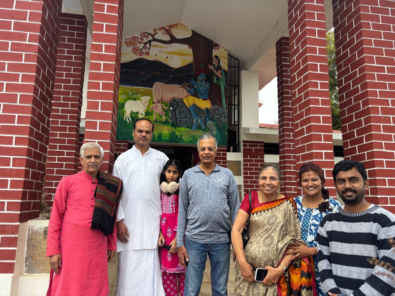 Volunteers and participants posing together during a seva activity at Dharitri Trust organized by Giridham Foundation